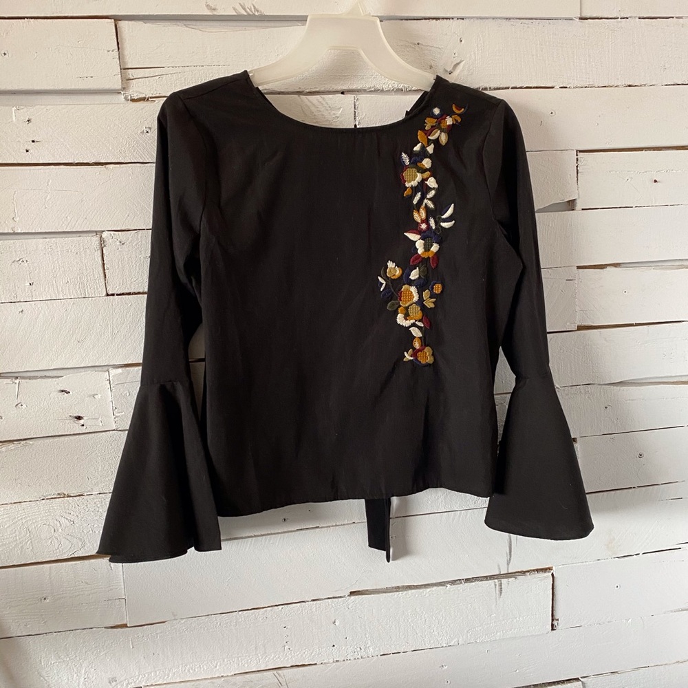Cliche” Black Top with Embroidered Flowers.
